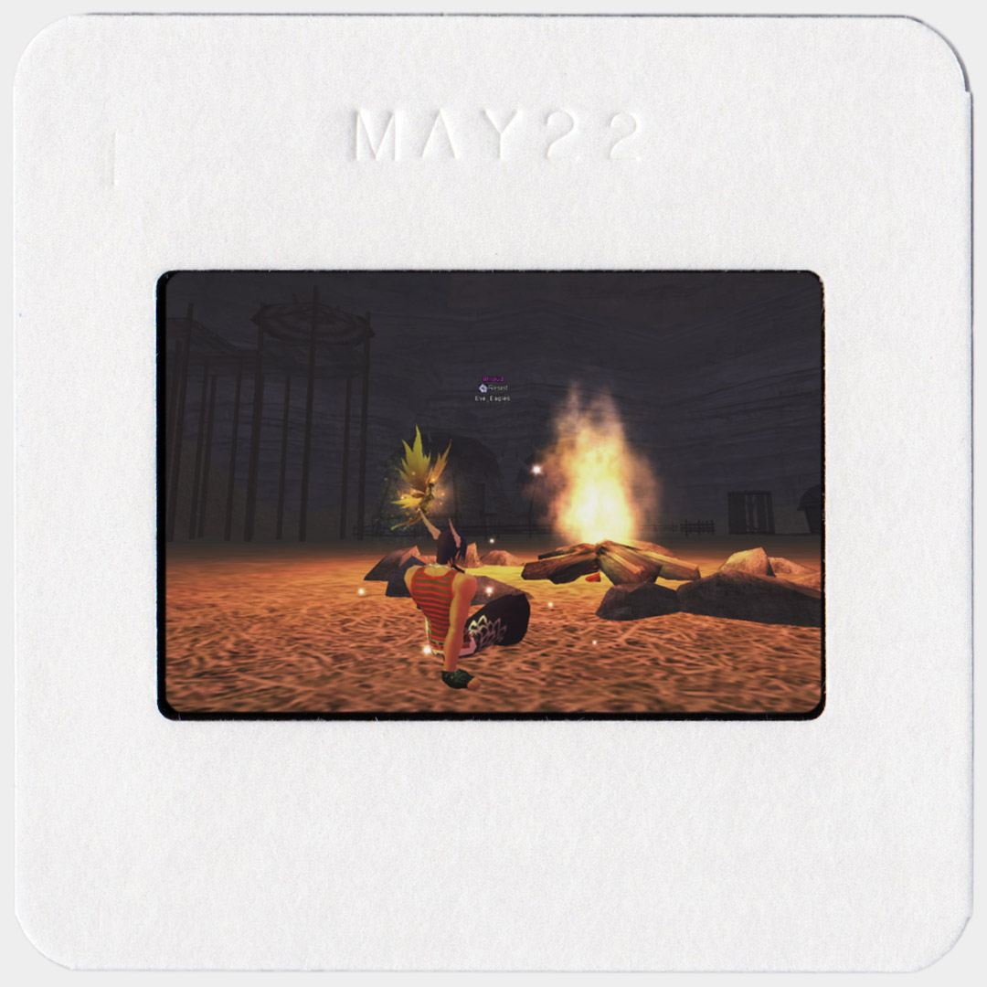 Scan of a colour film slide. The image on the slide is of an in-game screenshot of Perfect World International.