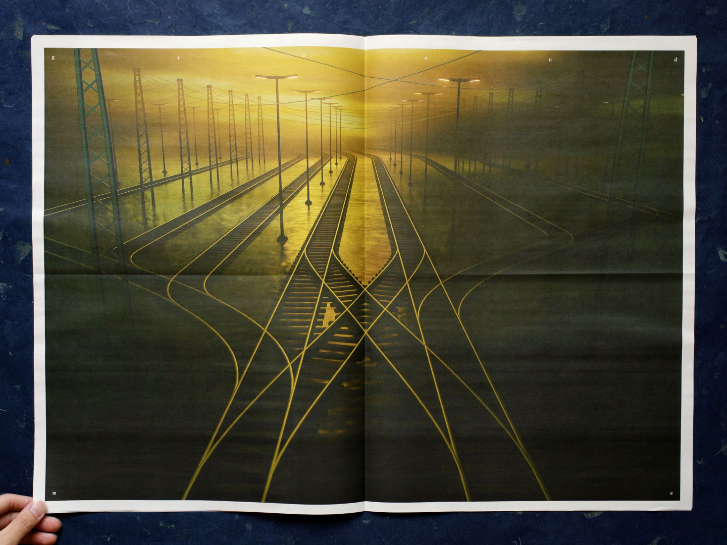 A spread from The Office for Postal Arts: 2026.08.20, showing a digital illustration of a foggy golden railyard